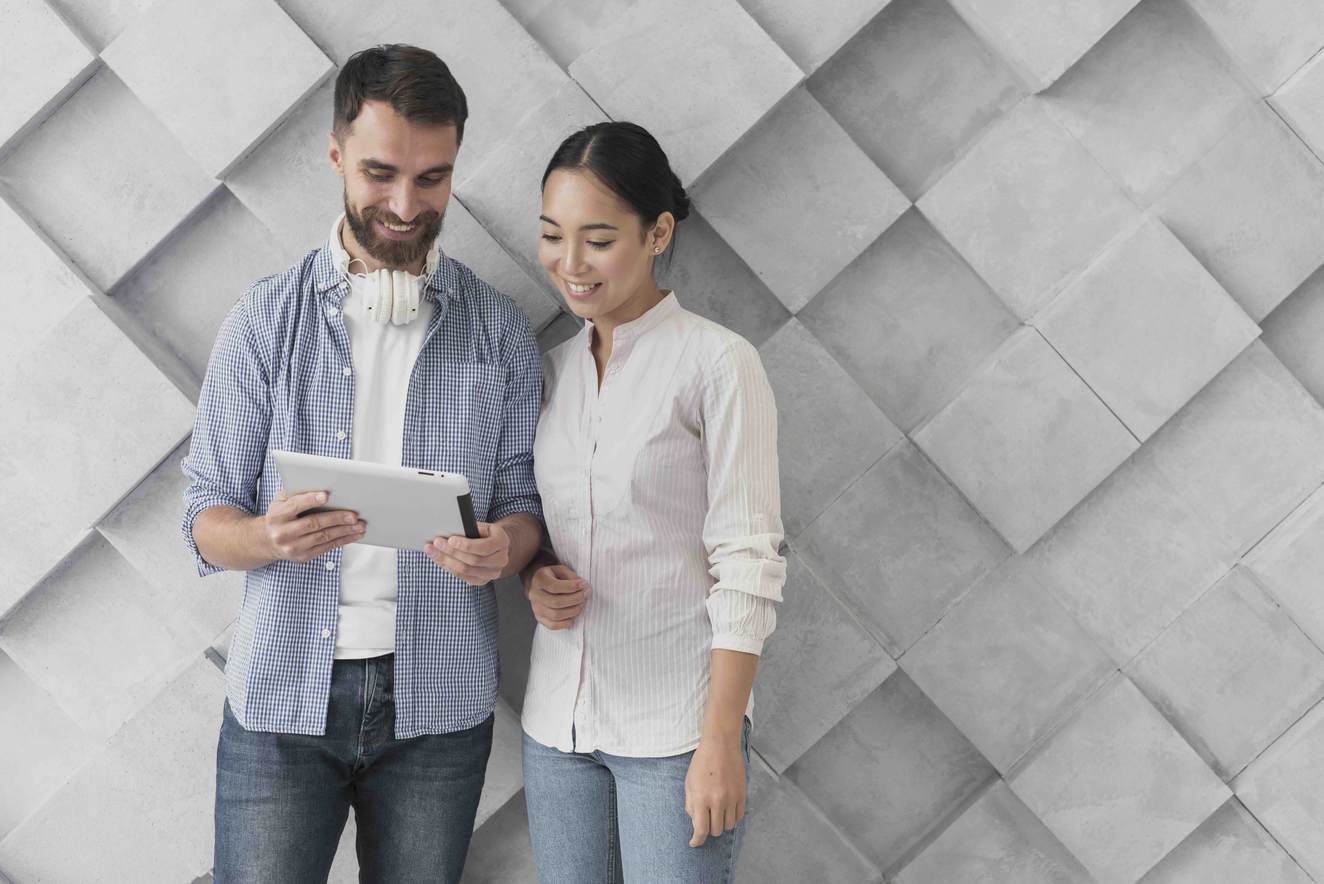copy-space-coworkers-looking-tablet