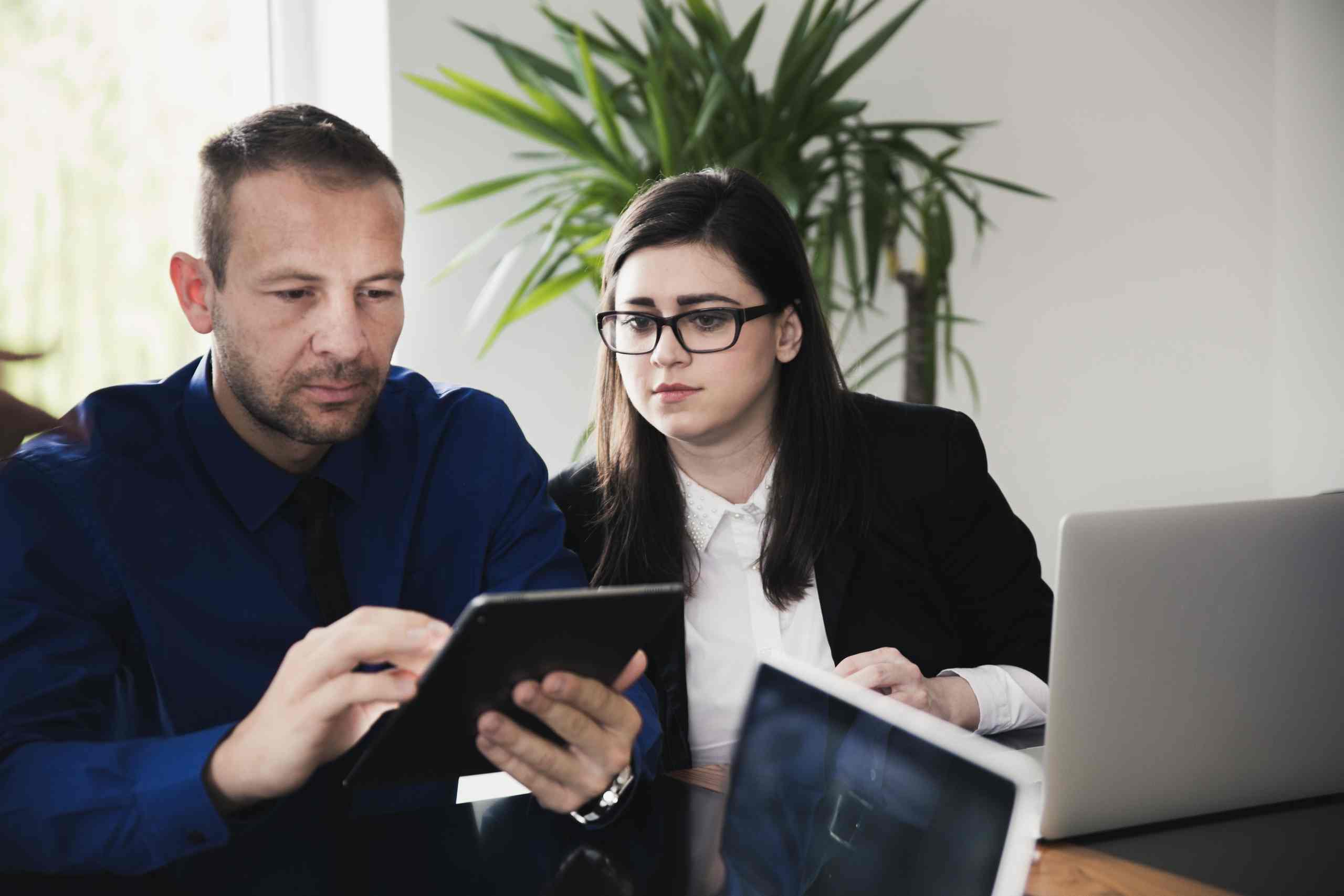two_people_office_tablet