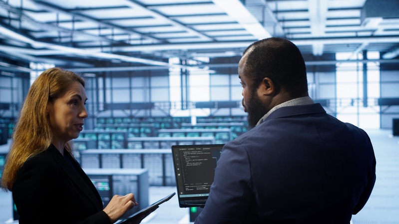 data-center-coworkers-doing-yearly-maintenance-using-laptop-tablet